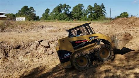 skid steer for digging a pond